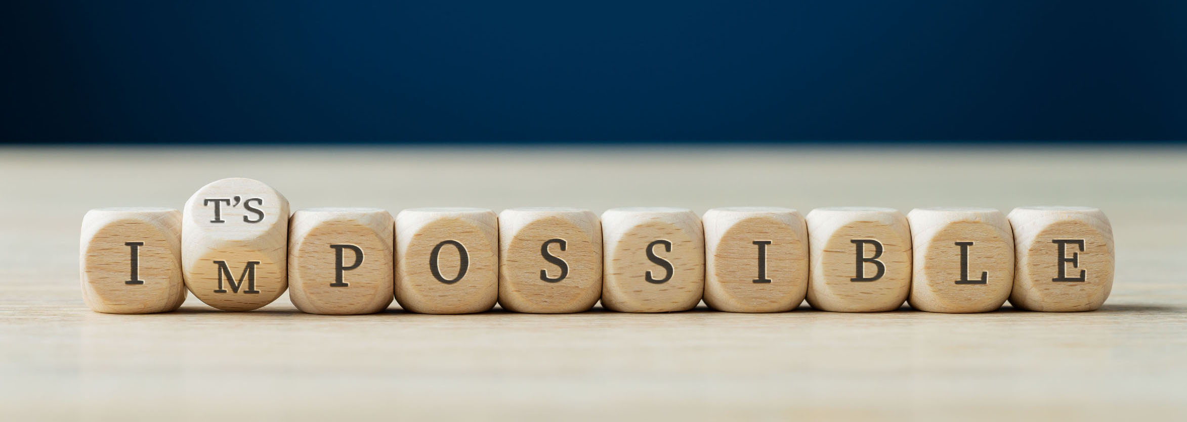 image of dice spelling impossible